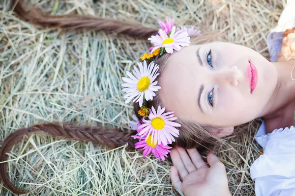 Girl with flower wreath outdoors — Stock Photo, Image