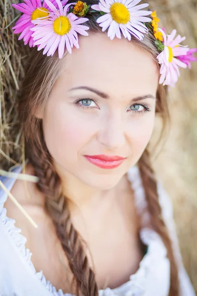 Girl with flower wreath outdoors — Stock Photo, Image