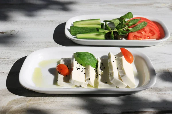 Plate Sliced Halloumi Cheese Garnished Nigella Seeds Basil Tomatoes — Foto de Stock