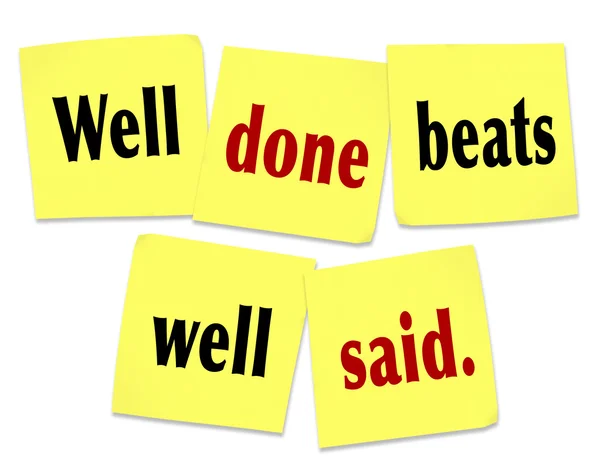Well done beats well said quote on sticky notes — Stockfoto