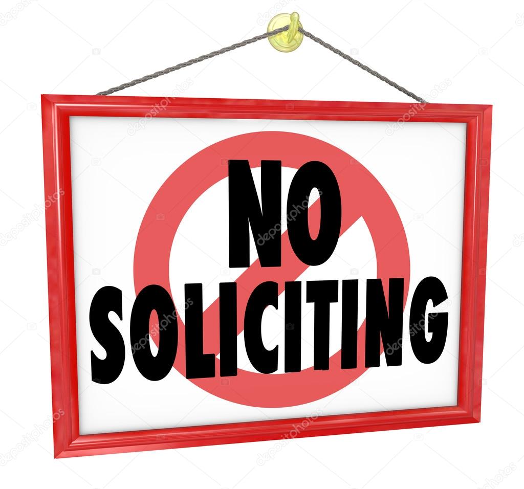 No Soliciting sign in a home or business window