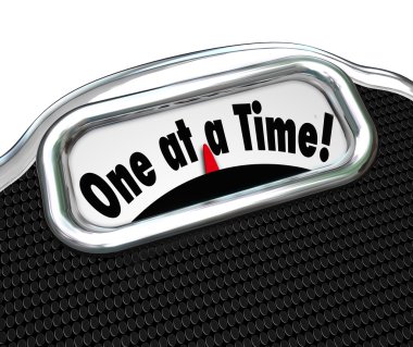 One at a Time words on a scale display clipart
