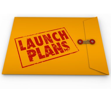 Launch Plans words stamped in red ink on yellow envelope clipart