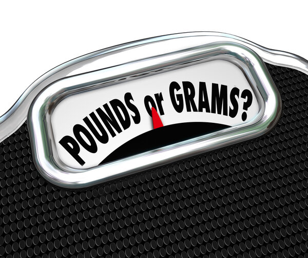 Pounds or Grams words on a display of a scale