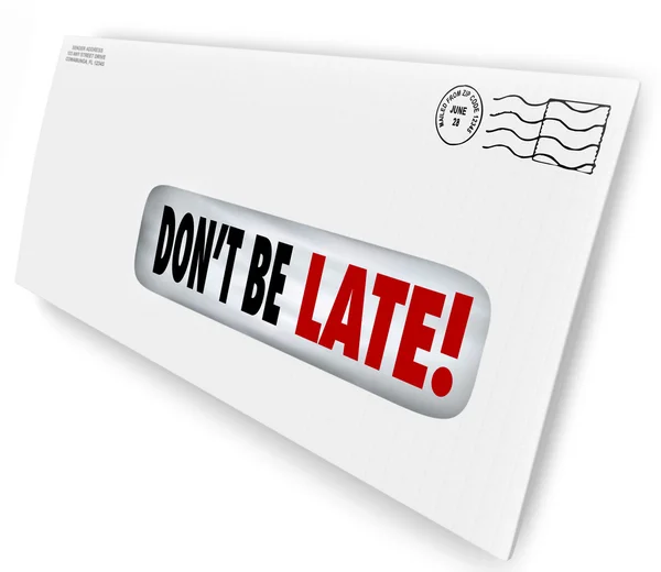 Don 't Be Late words of warning in a window envelope — стоковое фото