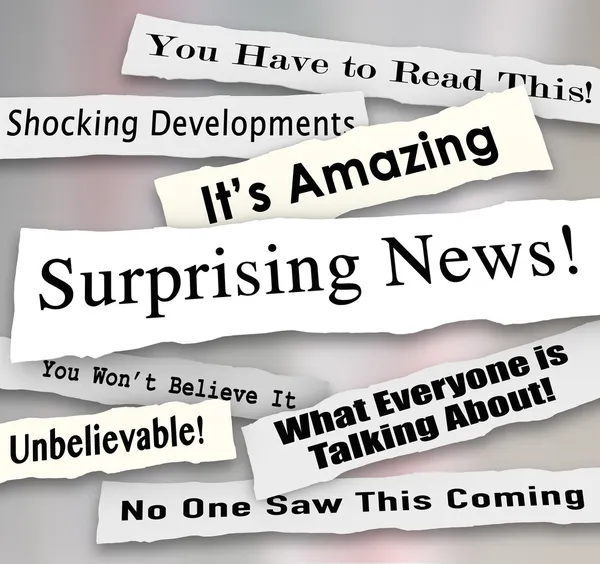 Surprising News headlines torn or ripped from newspapers — Stock Photo, Image