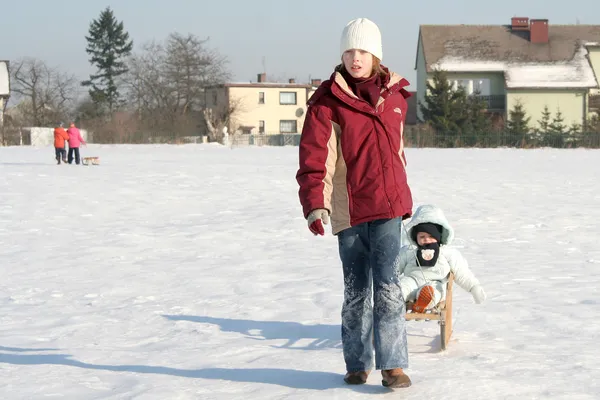 Sisters on snow — Stock Photo, Image