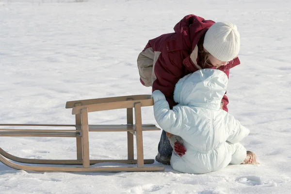 Sisters on snow — Stock Photo, Image