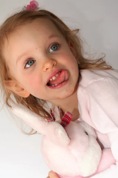 Baby girl and pink bunny — Stock Photo, Image