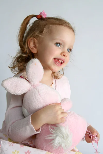 Baby girl and pink bunny — Stock Photo, Image