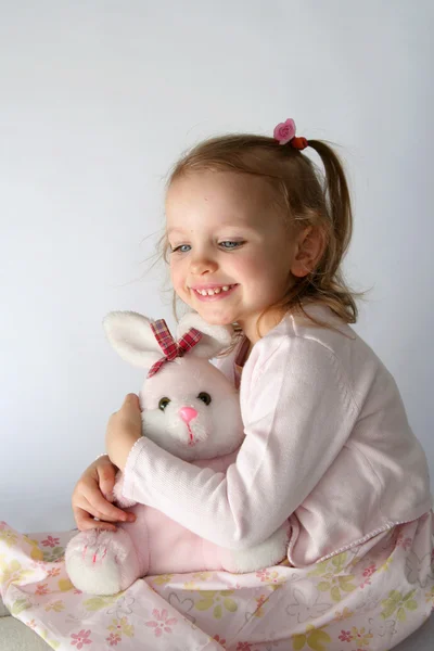 Baby girl and pink bunny — Stock Photo, Image