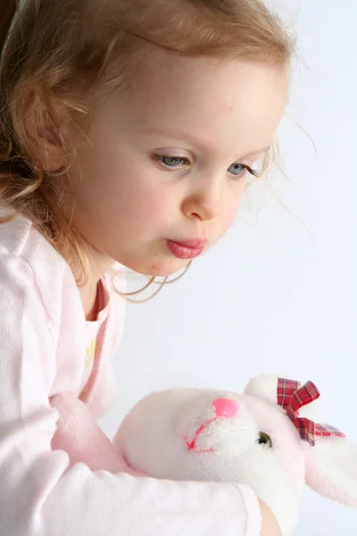 Baby girl and pink bunny — Stock Photo, Image