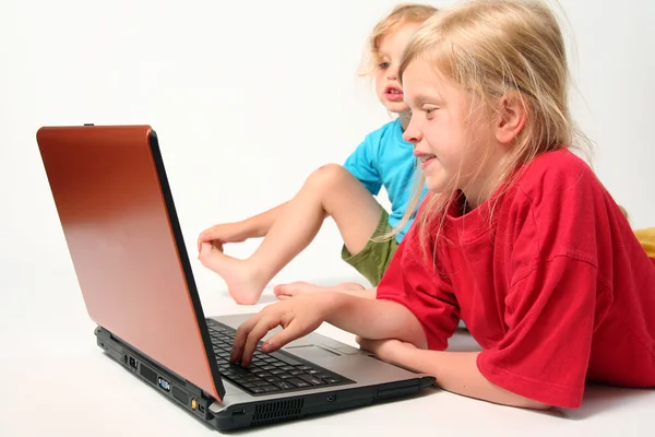 Playing on laptop — Stock Photo, Image