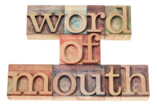 Word of mouth in wood type — Stock Fotó