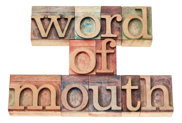 Word of mouth in wood type Stock Image