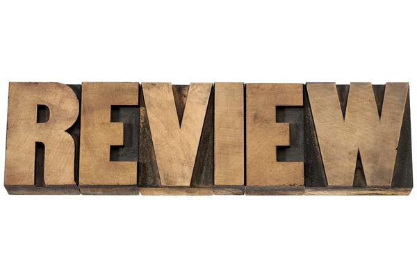 Review typography in wood type — Stock Photo, Image