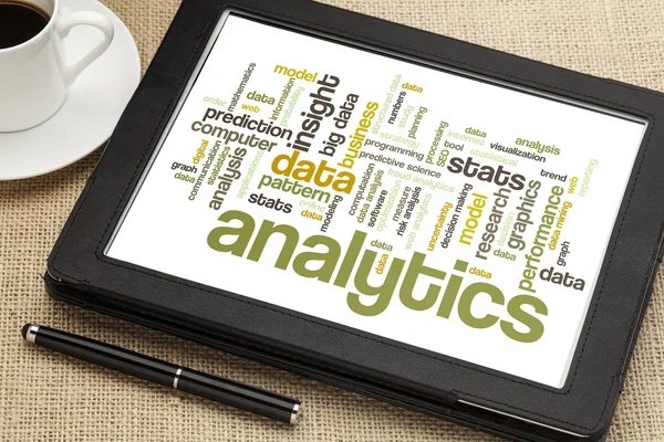 Analytics word cloud on digital tablet — Stock Photo, Image