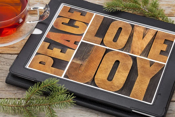 Love, joy and peace on digital tablet — Stock Photo, Image