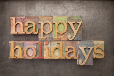 happy holidays in wood type