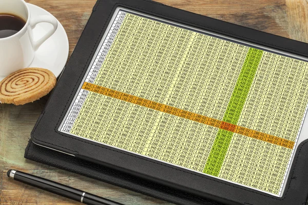 Data spreadsheet on digital tablet — Stock Photo, Image