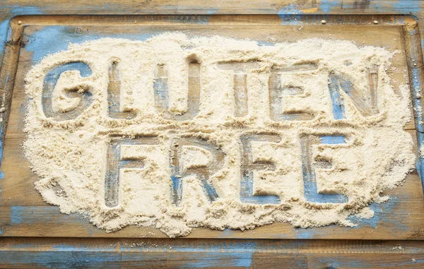 Gluten free words in flour — Stock Photo, Image