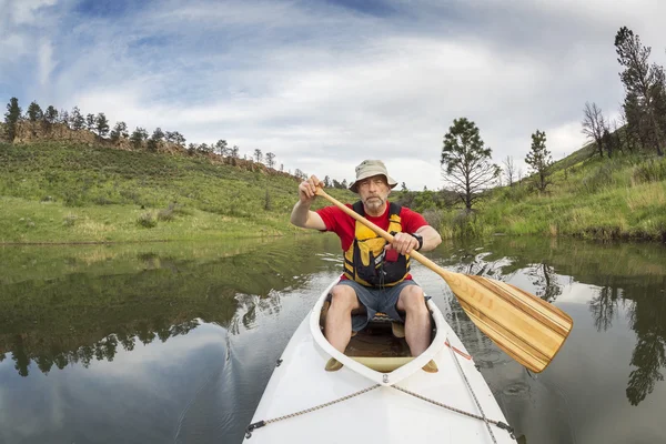 Senior athletic canoe paddler — Stock Photo, Image