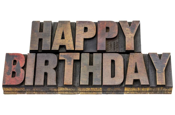 Happy birthday in grunge wood type — стоковое фото