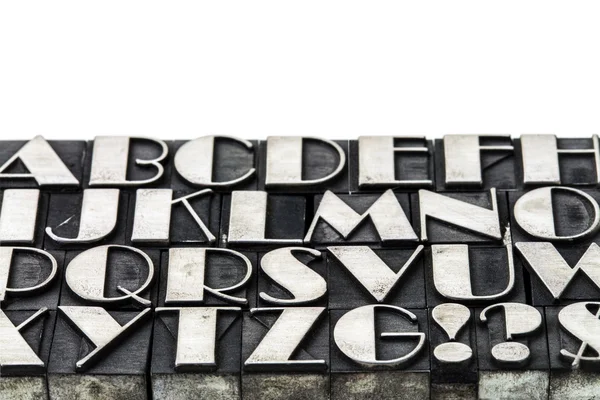 Alphabet abstract in metal type — Stock Photo, Image