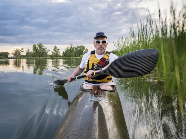 Paddling sea kayak on a lake — Stock Photo, Image