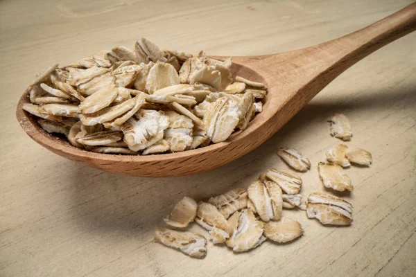 Gluten Free Organic Rolled Oats Rustic Wooden Spoon Macro Shot — Stock Photo, Image