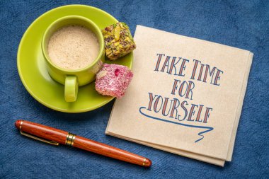take time for yourself inspirational note - handwriting on a napkin with a cup of coffee and candy, self care and de-stress concept