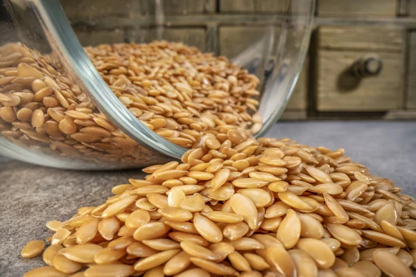 Golden Flax Seeds Spilled Glass Jar Low Angle Macro Shot — Stock Fotó