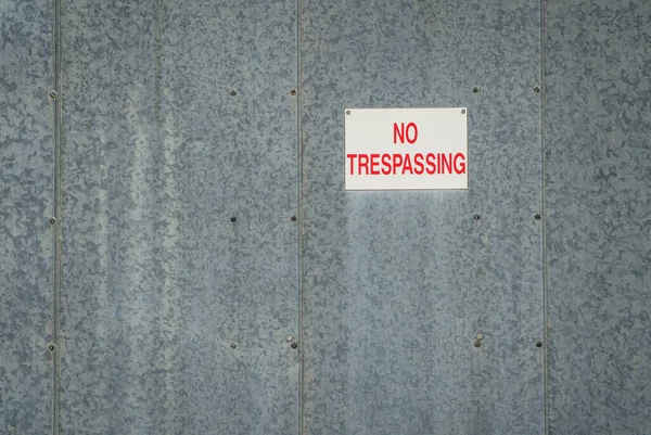 Red White Trespassing Sign Gavanized Metal Building Wall — Stock Photo, Image