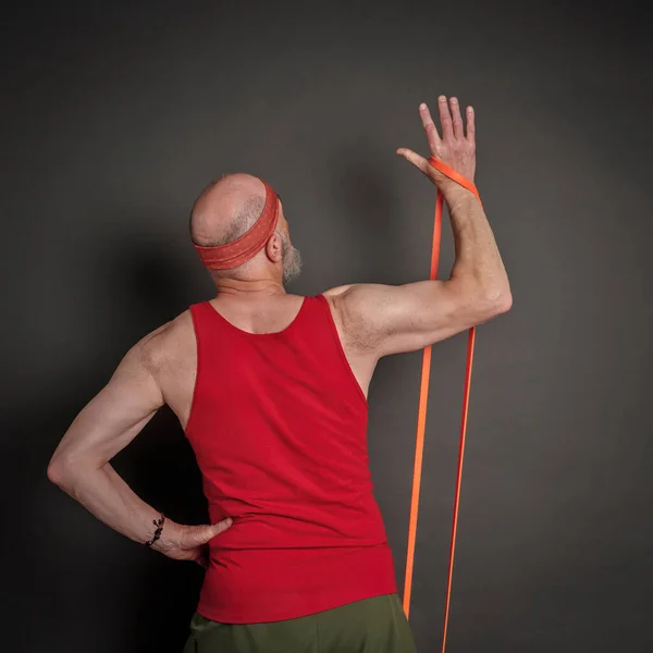 Head Shoulder Portrait Senior Man Late 60S Exercising Resistance Band — Stock Photo, Image