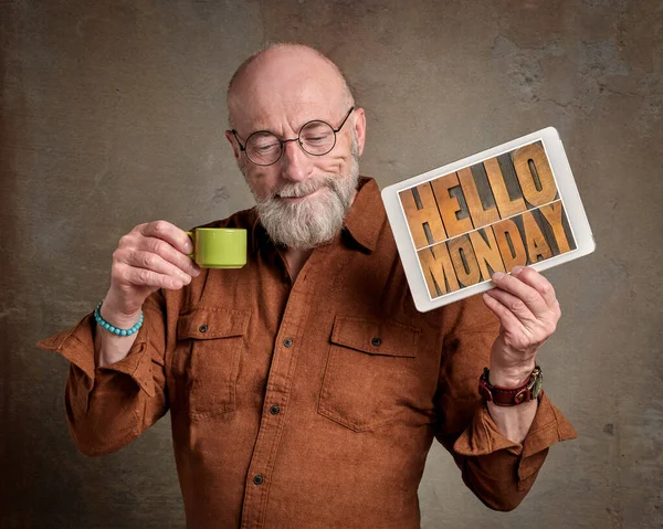 Hello Monday Smiling Senior Man Drinking Coffee Showing Digital Tablet — Stock Fotó