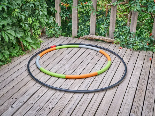 Weighted Hula Hoop One Home Made Sprinkler Pipe Wooden Backyard — Fotografia de Stock