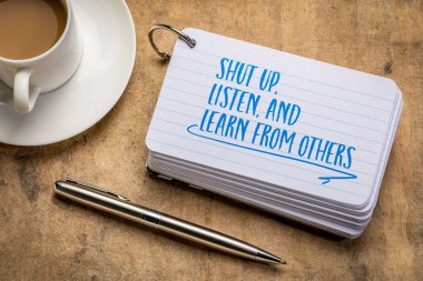 shut up, listen, and learn from others advice - handwriting on an index card with a cup of coffee, communication, learning and personal development concept