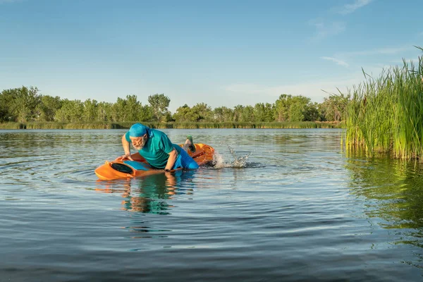 Athletic Senior Man Boarding Prone Kayak Lake Colorado Water Sport — ストック写真