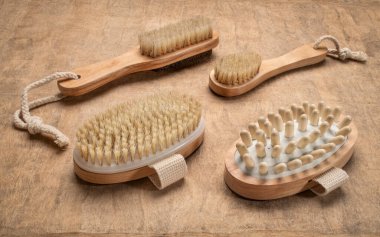 dry brushing and self massage kit with natural boar bristle on a handmade bark paper, self care concept