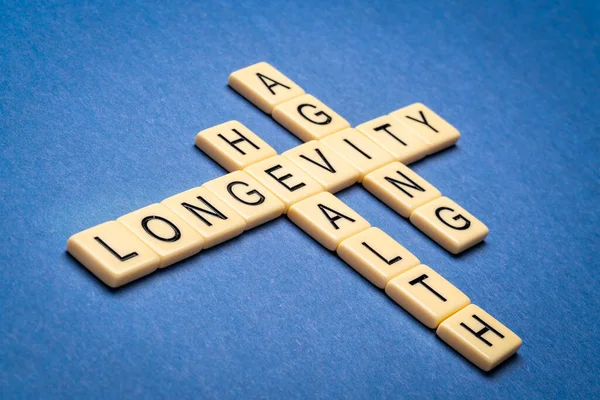 Longevity Health Aging Crossword Word Ivory Letter Tiles Textured Handmade — Stock Photo, Image