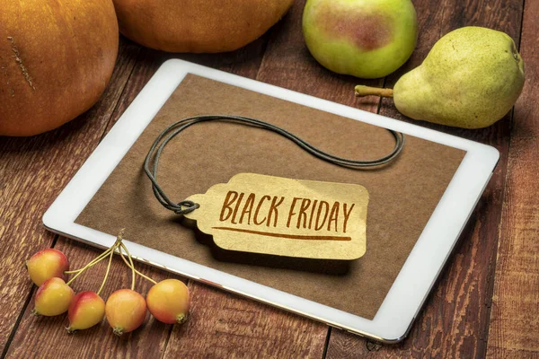 Black Friday Sale Sign Paper Price Tag Digital Tablet Surrounded Stock Image