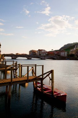 small dock with a boat on the coast of the Basque Country