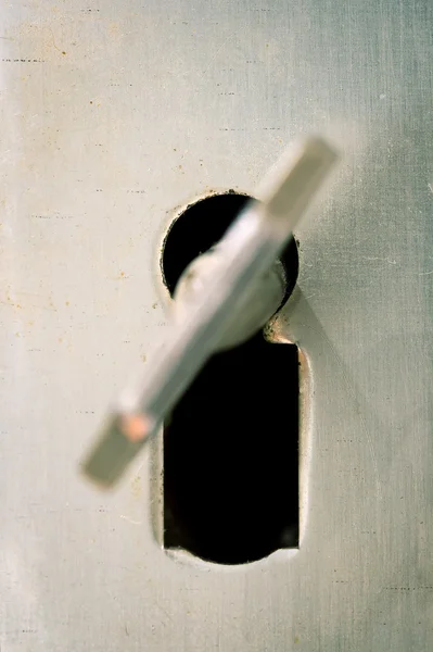 Key in a keyhole — Stock Photo, Image