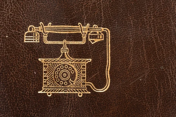 Régi bőr telefonkönyv arany telefon szimbólum — Stock Fotó
