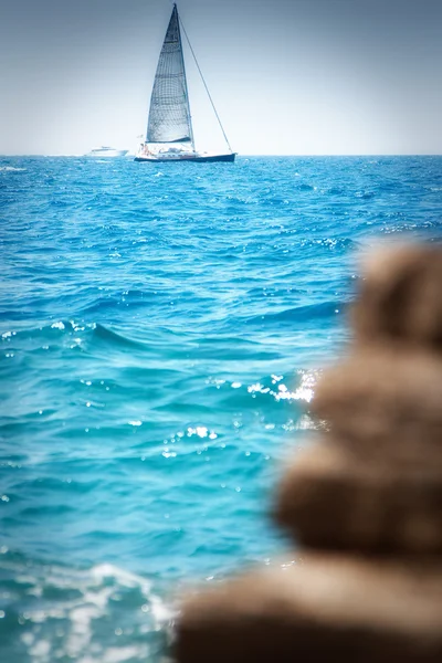 Sailboat near the coast on a sunny day — Stock Photo, Image