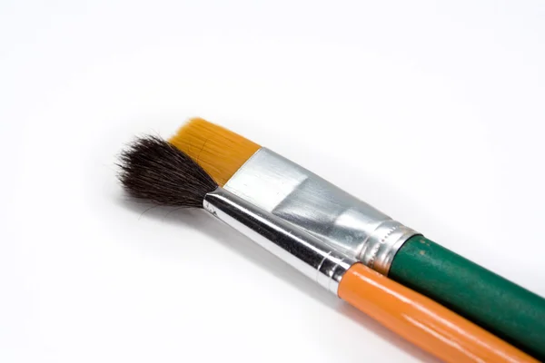 Two artistic paint brushes on white background — Stock Photo, Image