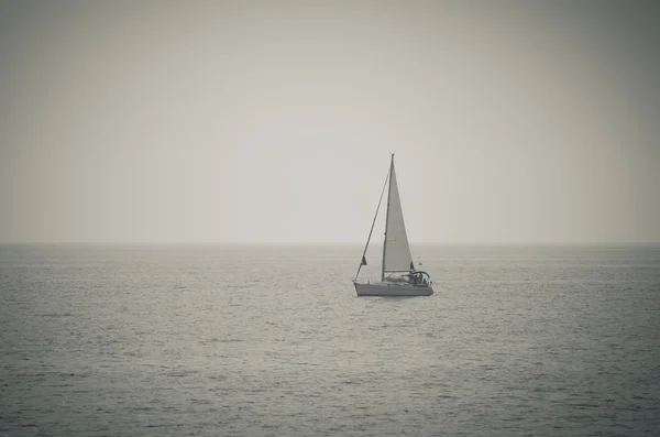 Retro toned  picture of yacht sailing on the sea — Stock Photo, Image