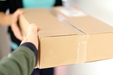 Woman receiving parcel clipart
