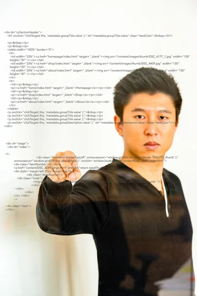 Pointing towards sourcecode projected on glass — Stock Photo, Image