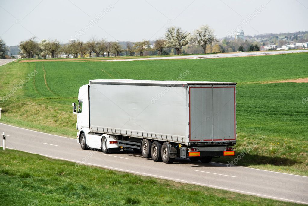 White truck moving on a main road